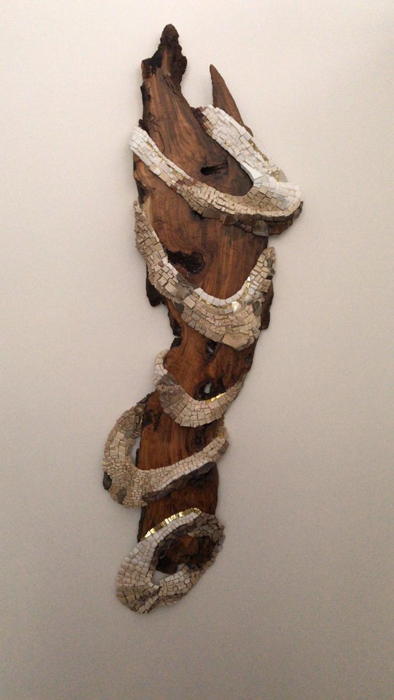 Dance, a natural stone spiral on olive wood