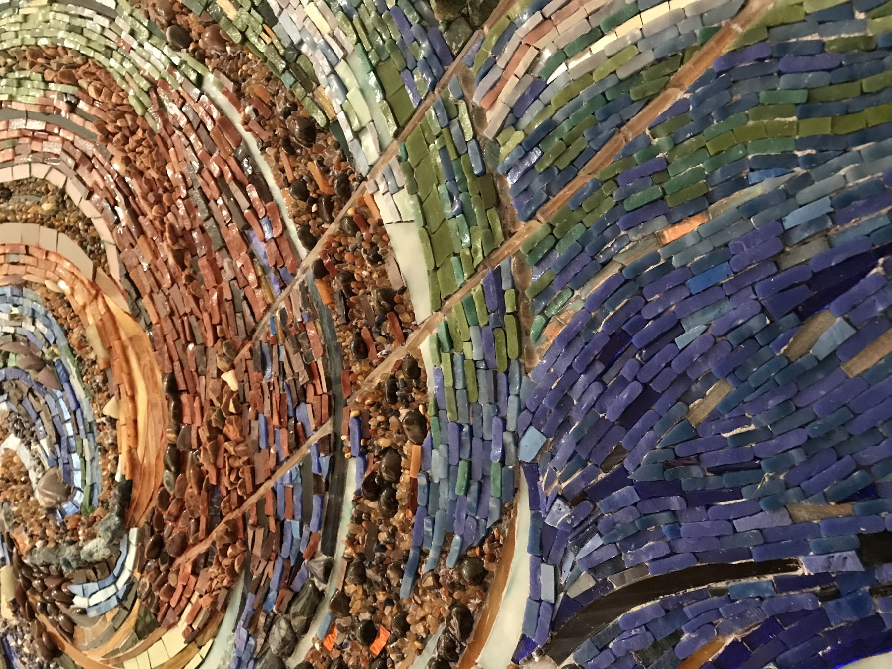 Swirl of Motion, a swirling current in glass, smalti and semi-precious stones